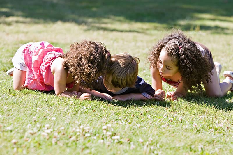 children playing in grass