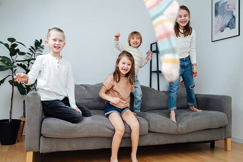 children playing on a couch